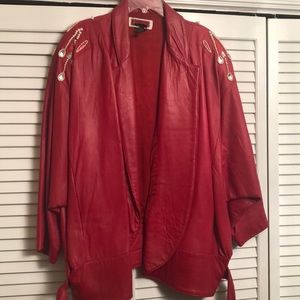 Real leather jacket with crystals and pearls.